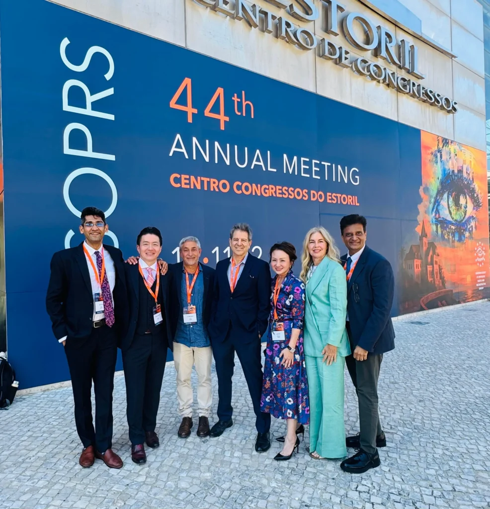 Dr. Adit Gupta (far left) alongside international delegates and faculty members outside the Centro de Congressos do Estoril.